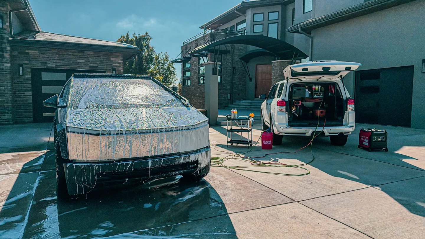 Foam wash on a Cybertruck beside the ACS mobile service van