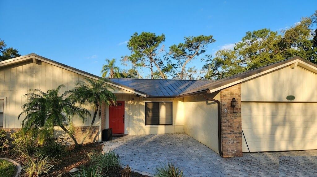After: Ranch home with new metal roof