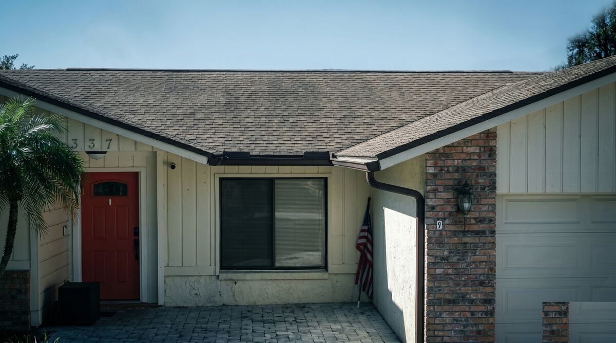 Before: Ranch home with aging shingles