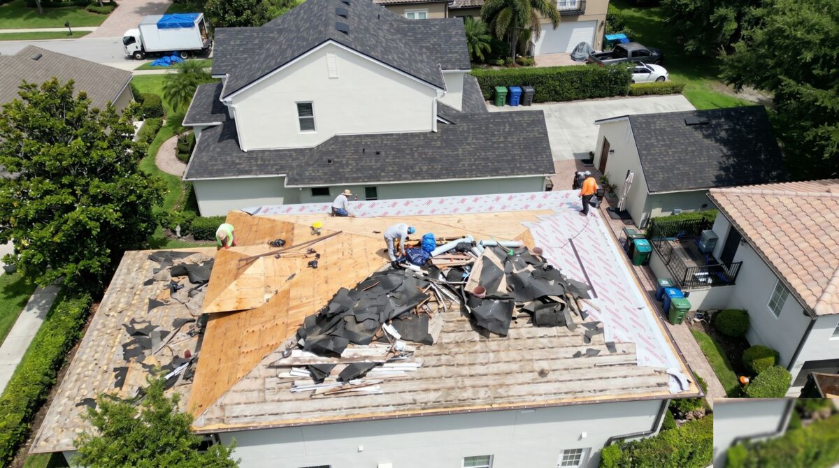 Before: Aerial view of damaged shingle roof