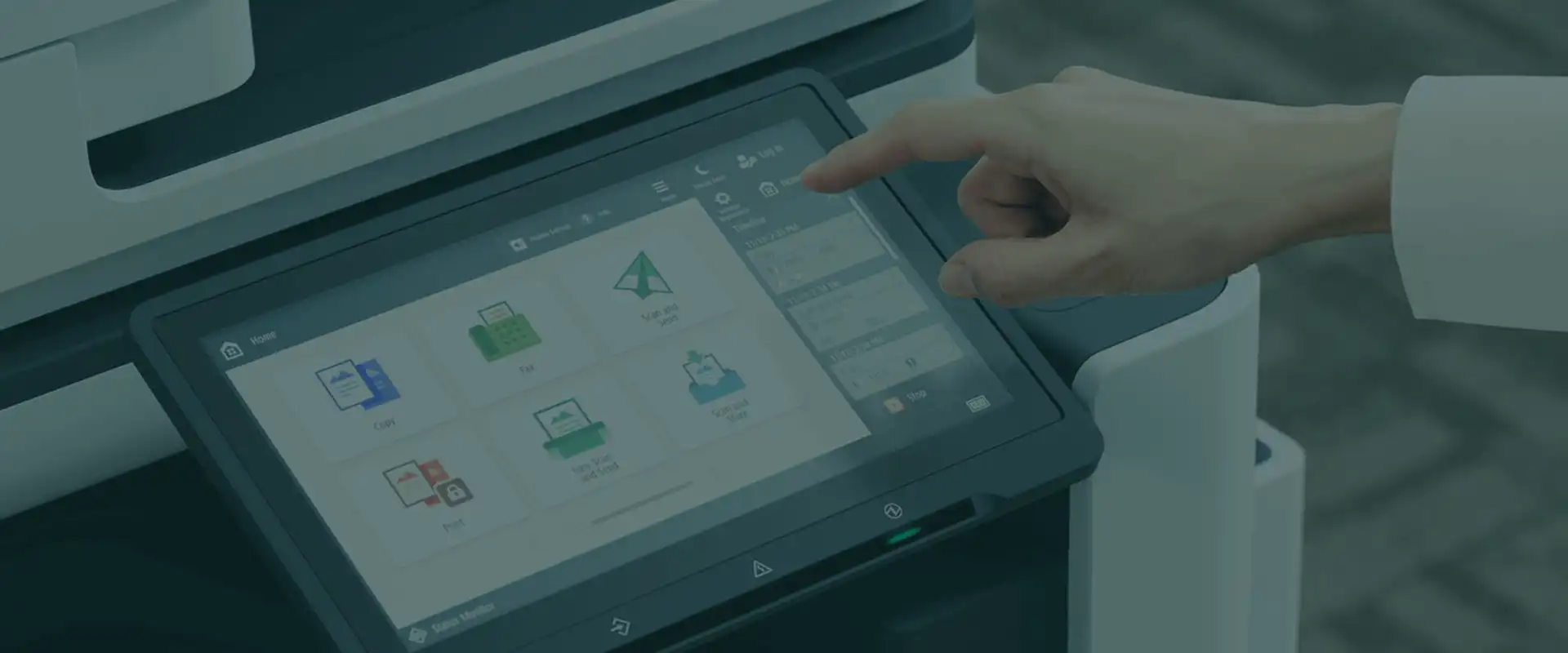 Person touching the control panel touchscreen of an office multifunction printer to release a print job