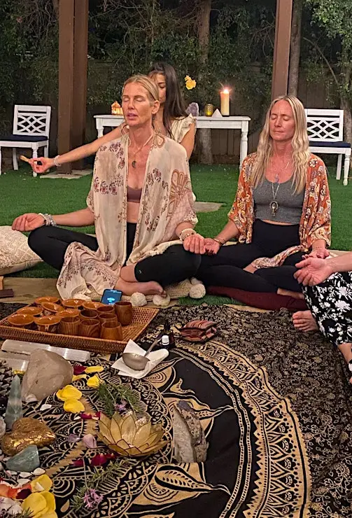 Sandra and Kelowna leading a healing session in the garden
