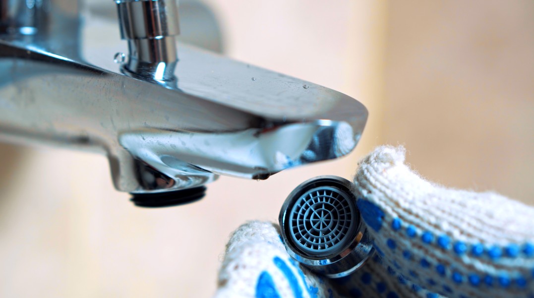 Faucet aerator installed to reduce water usage at home