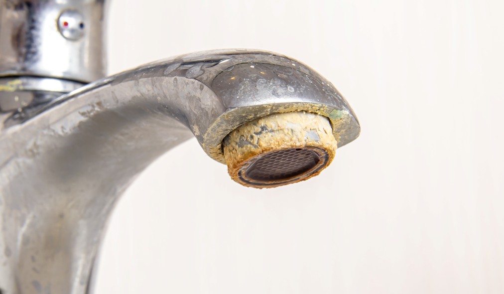 Hard water buildup affecting an efficient plumbing system
