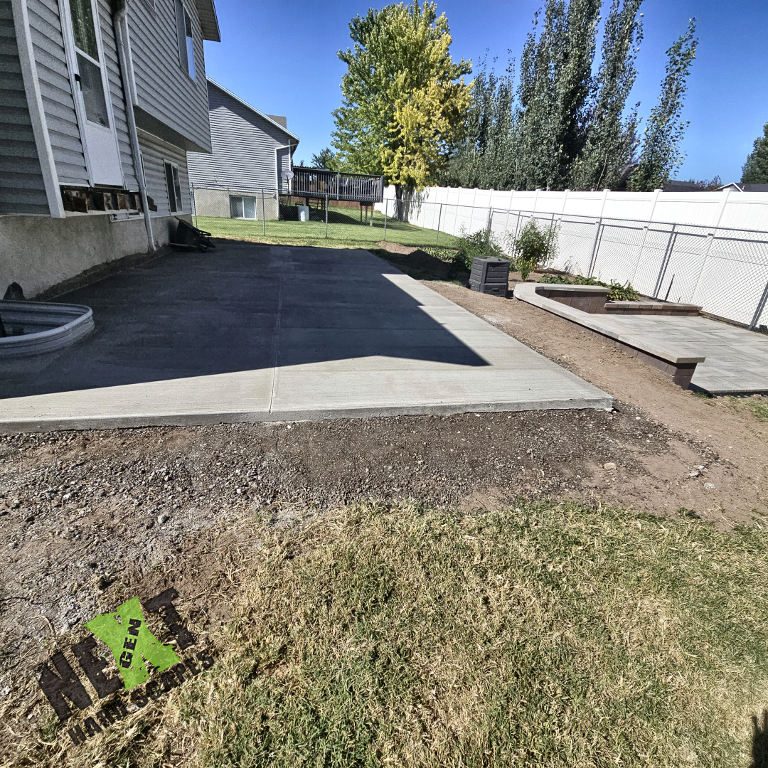 Close-up of the retaining wall bench and paver installation detailing next to the garden area.