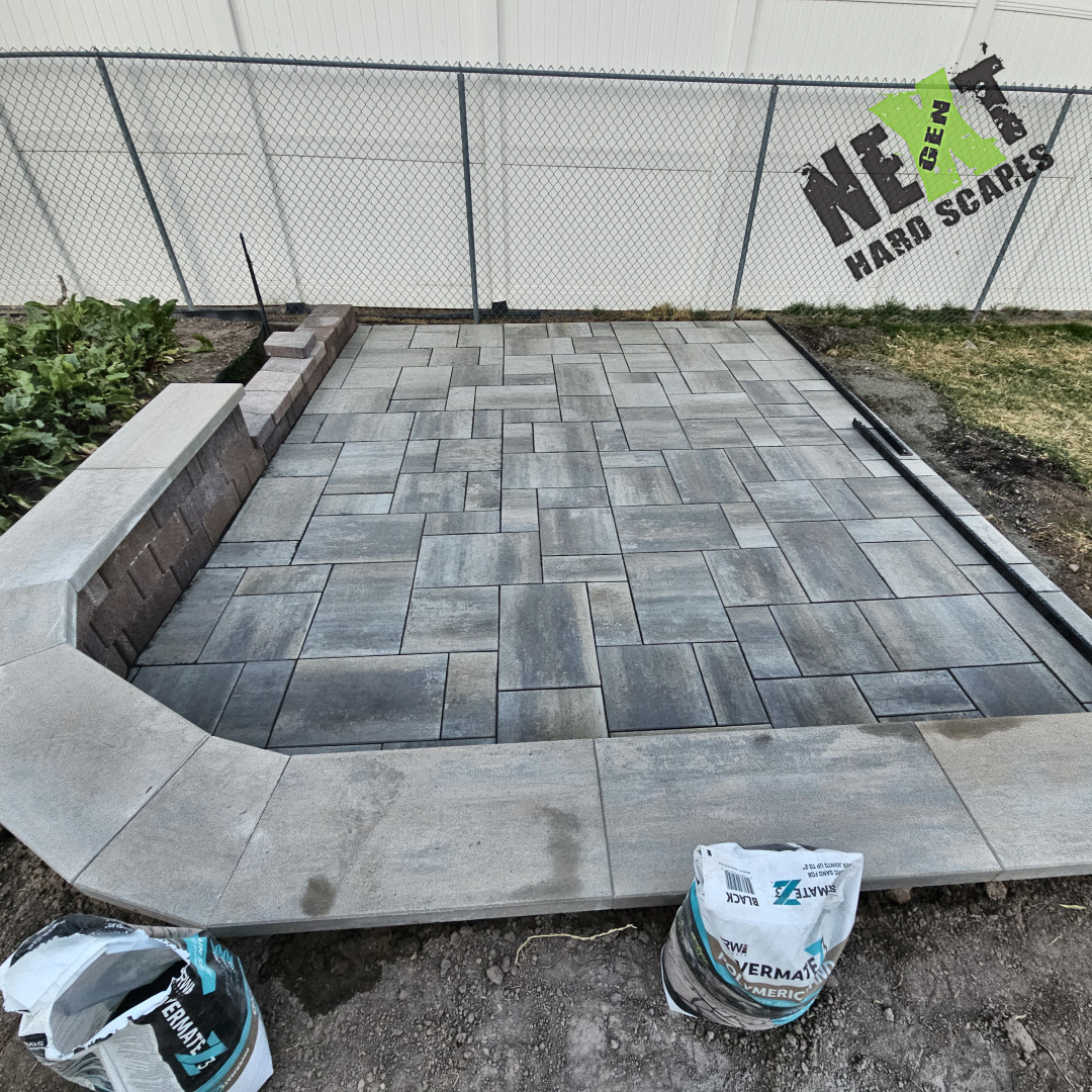 Close up of the paver patio, surrounded by the paver-based retaining wall. 