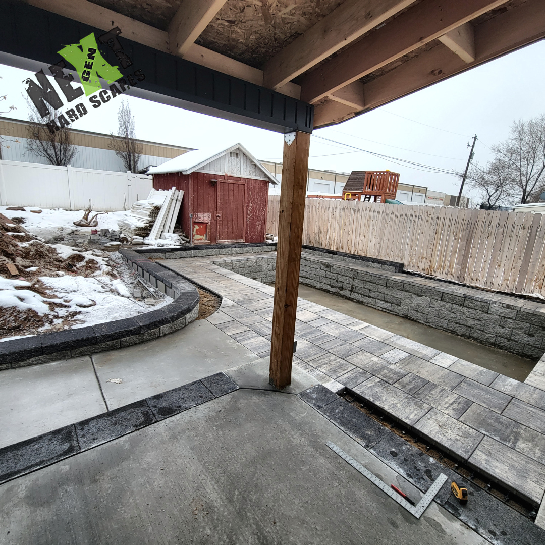 Concrete base poured and brick retaining wall installed to frame the swim spa, with clean block alignment and capped edges. Concrete base poured and brick retaining wall installed to frame the swim spa, with clean block alignment and capped edges.