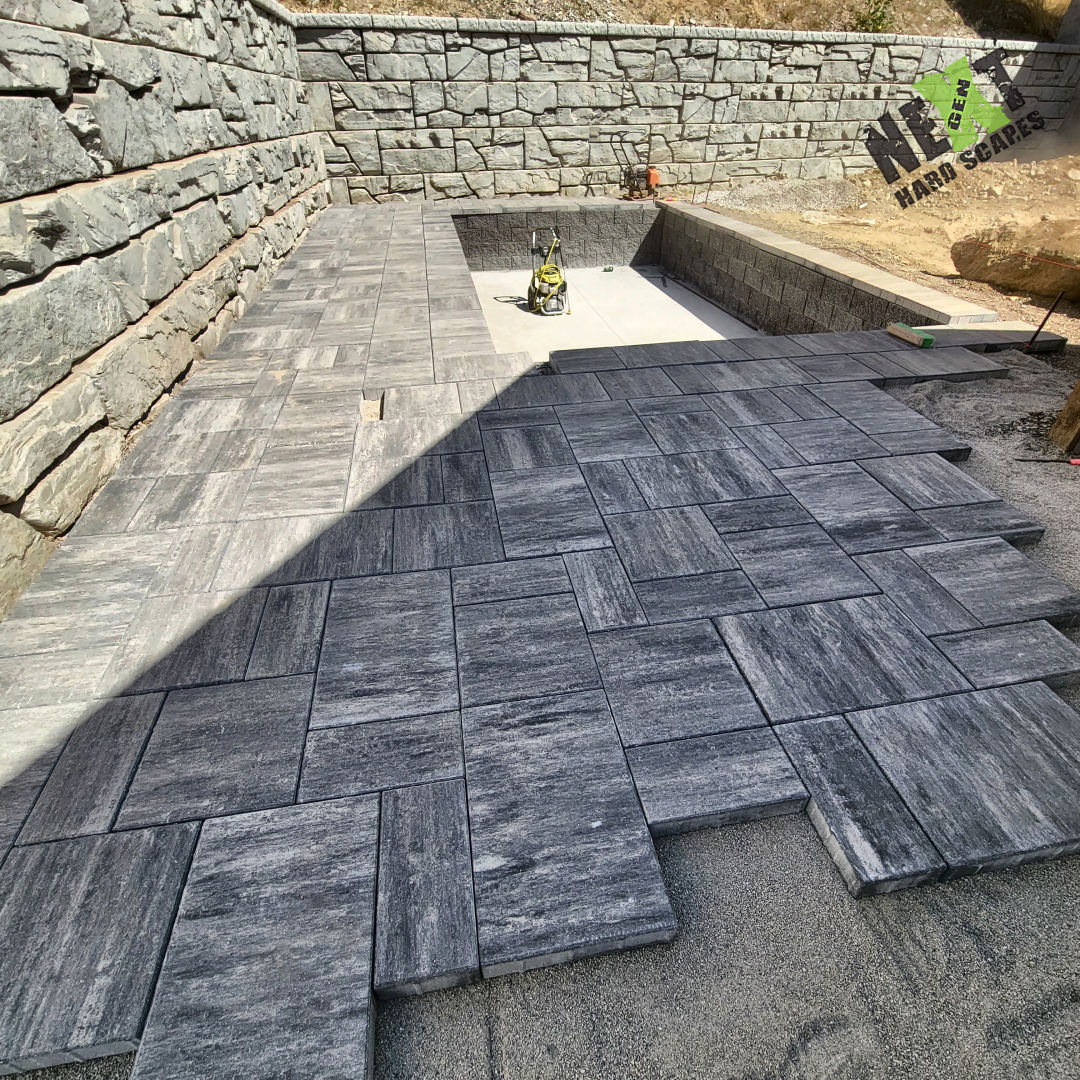 Laying out a modern pattern for the stone pool deck. Laying out a modern pattern for the stone pool deck.