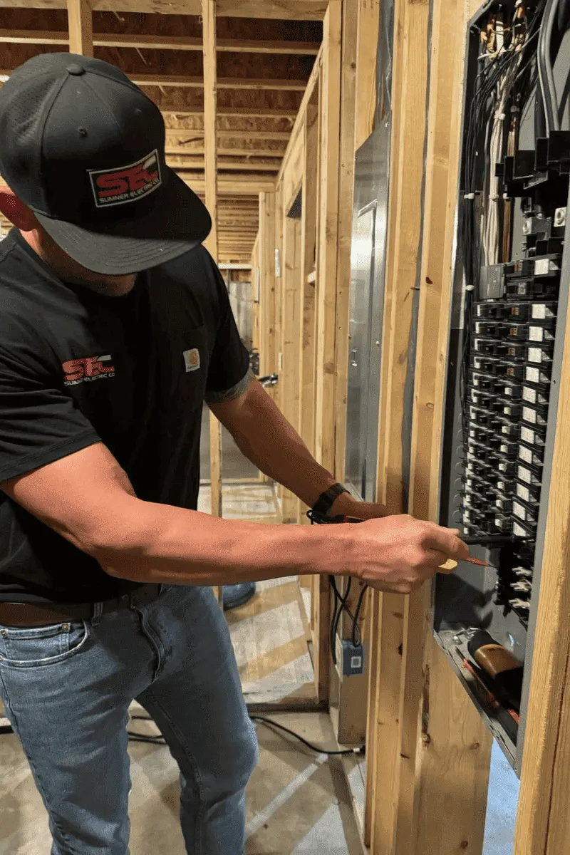 Experienced local electrician testing a residential electrical meter during a comprehensive safety inspection in North Metro Atlanta.