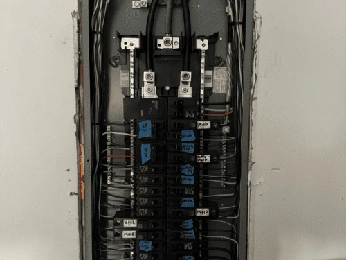 Cleanly organized and code-compliant electrical panel with industrial components wired by a Cartersville commercial electrician.