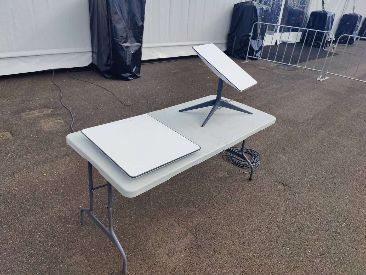Satellite internet dish on a trestle table at an event