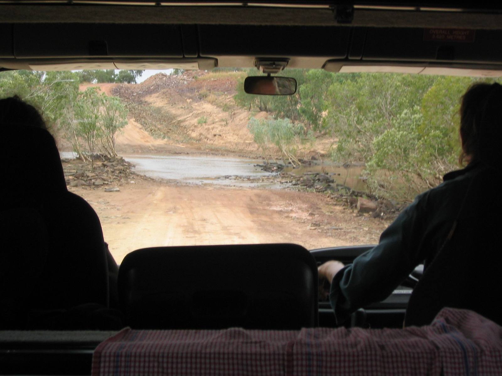 View from inside a 4WD on a red dirt outback road