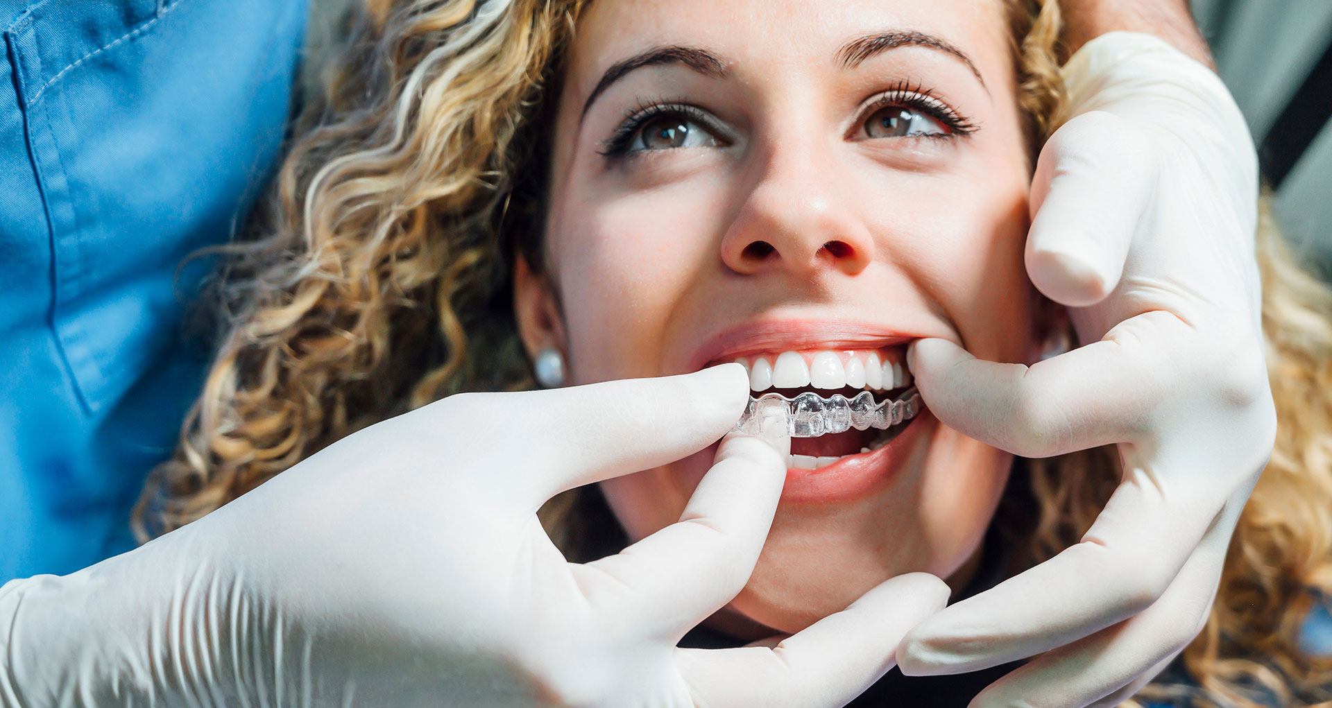 Woman holding invisalign