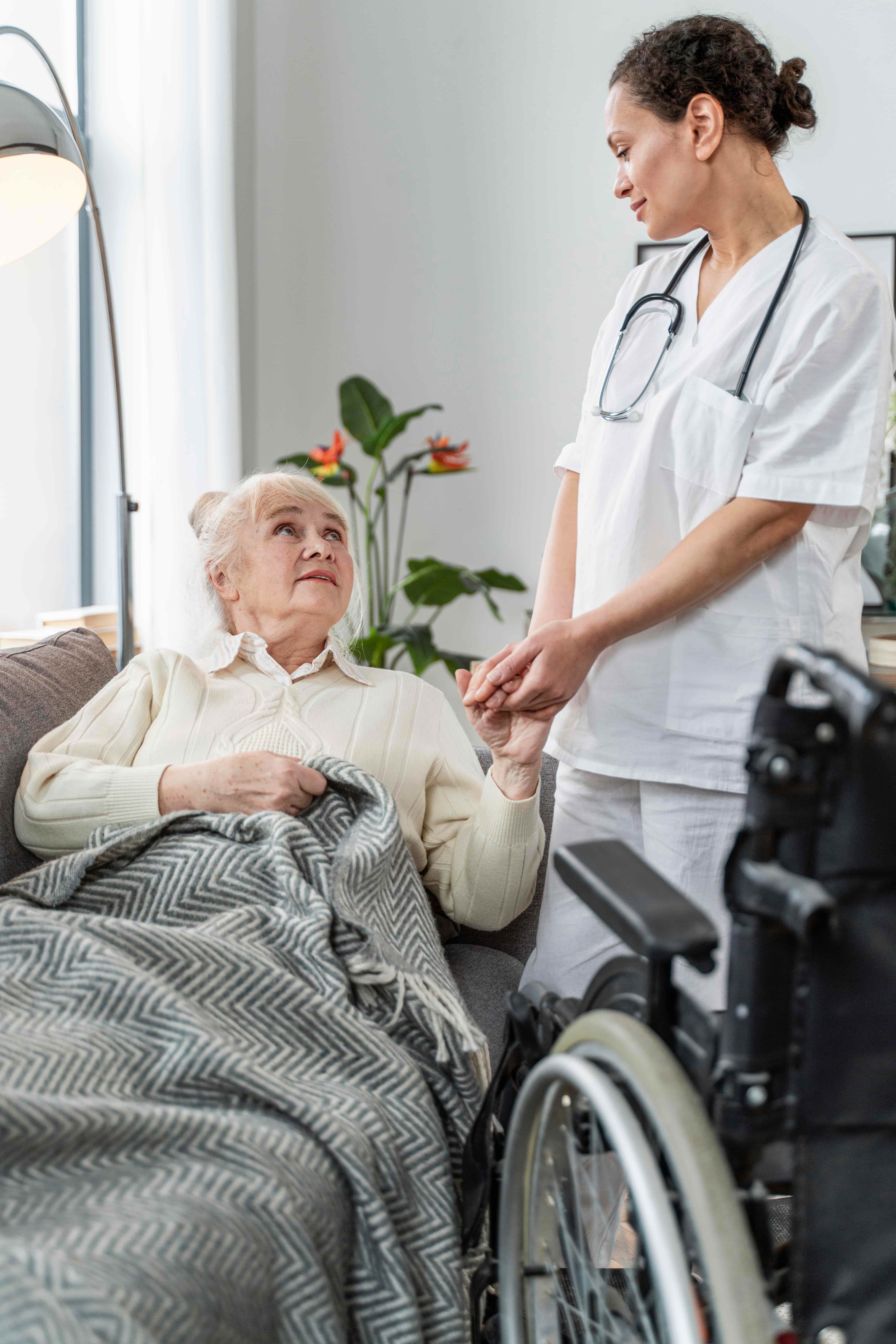 Senior woman talking with her doctor during a medical consultation, receiving advice and support for her health.
