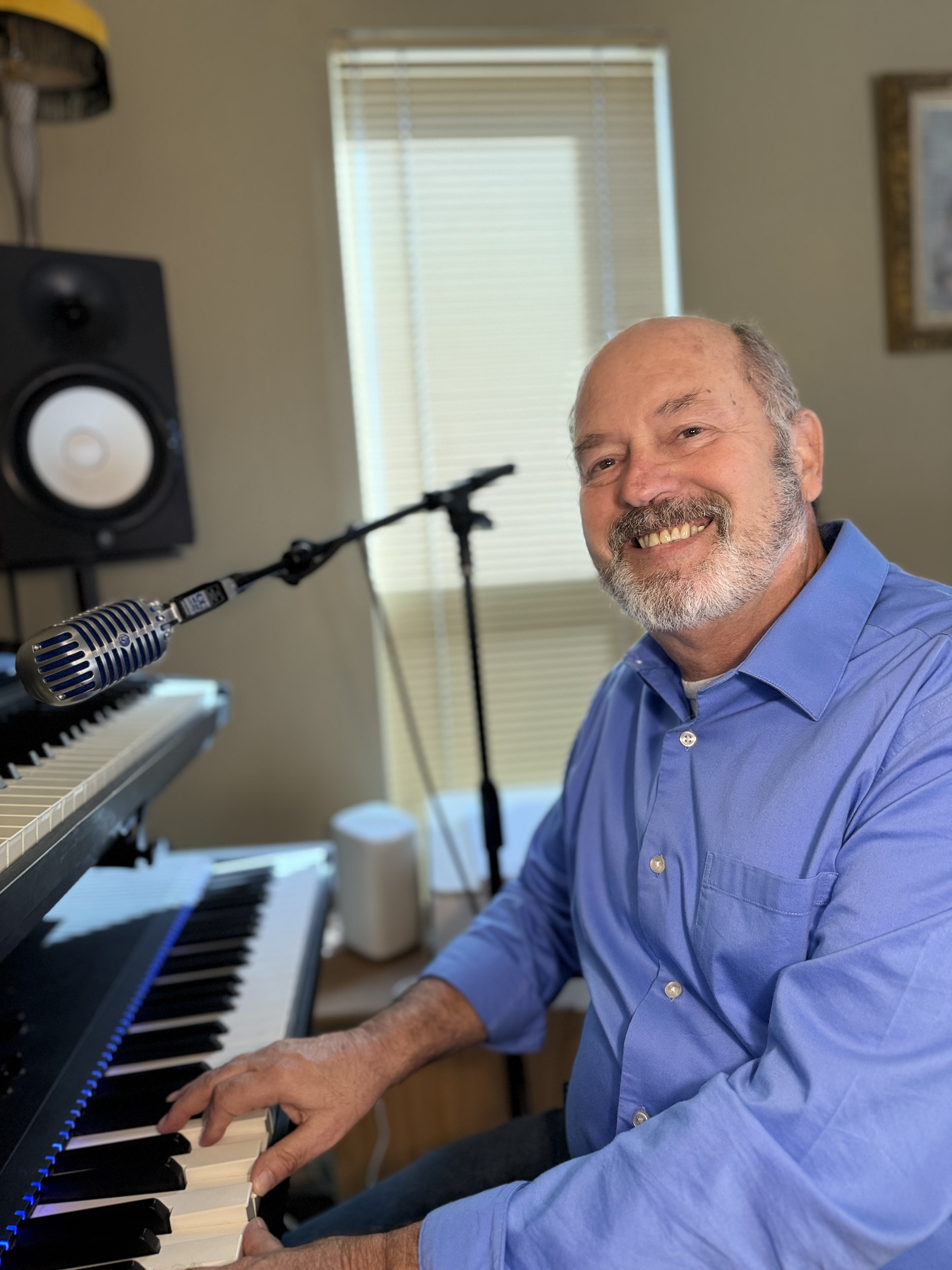 Randy Reynolds at his piano in his home studio