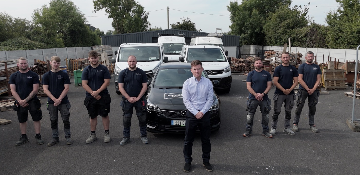 Brian with his crew in front of the vans