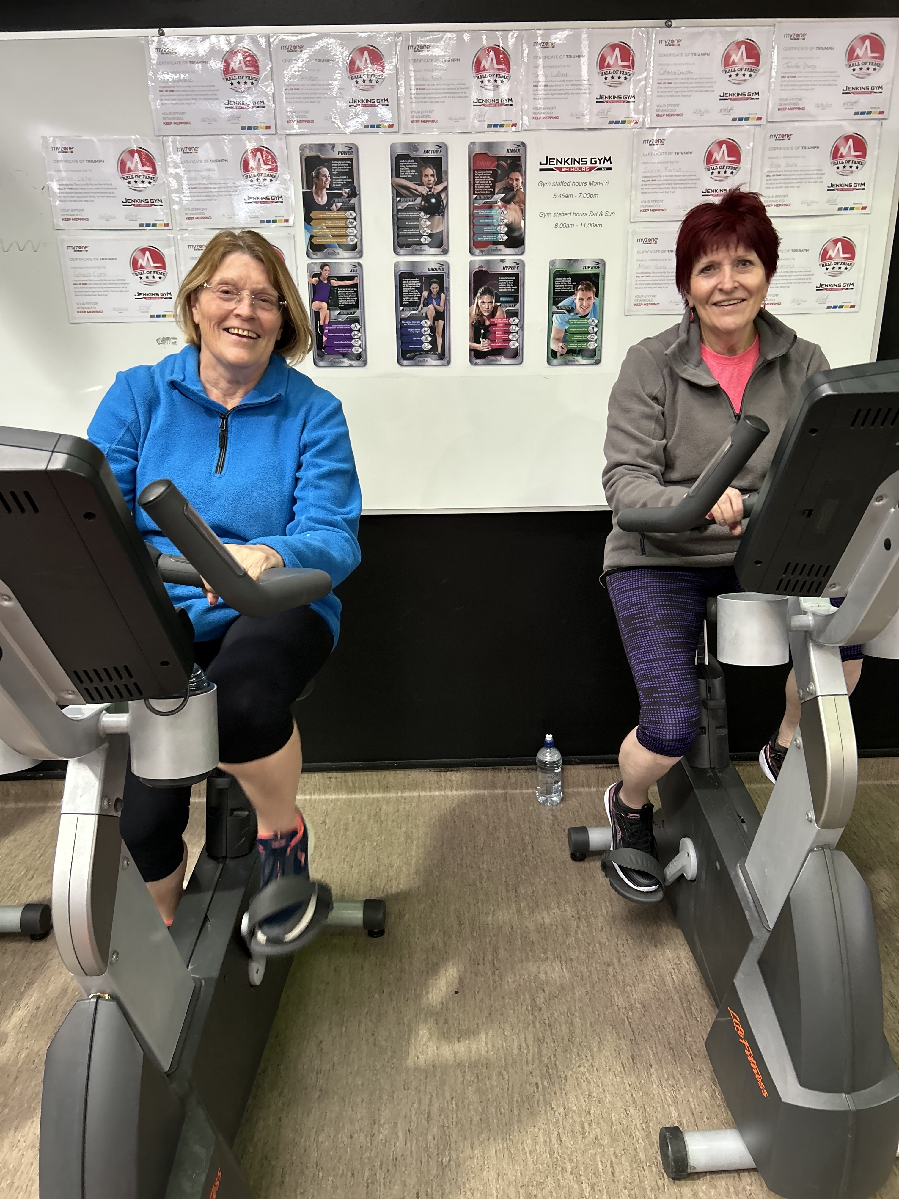 Two smiling women exercising at Jenkins Gym