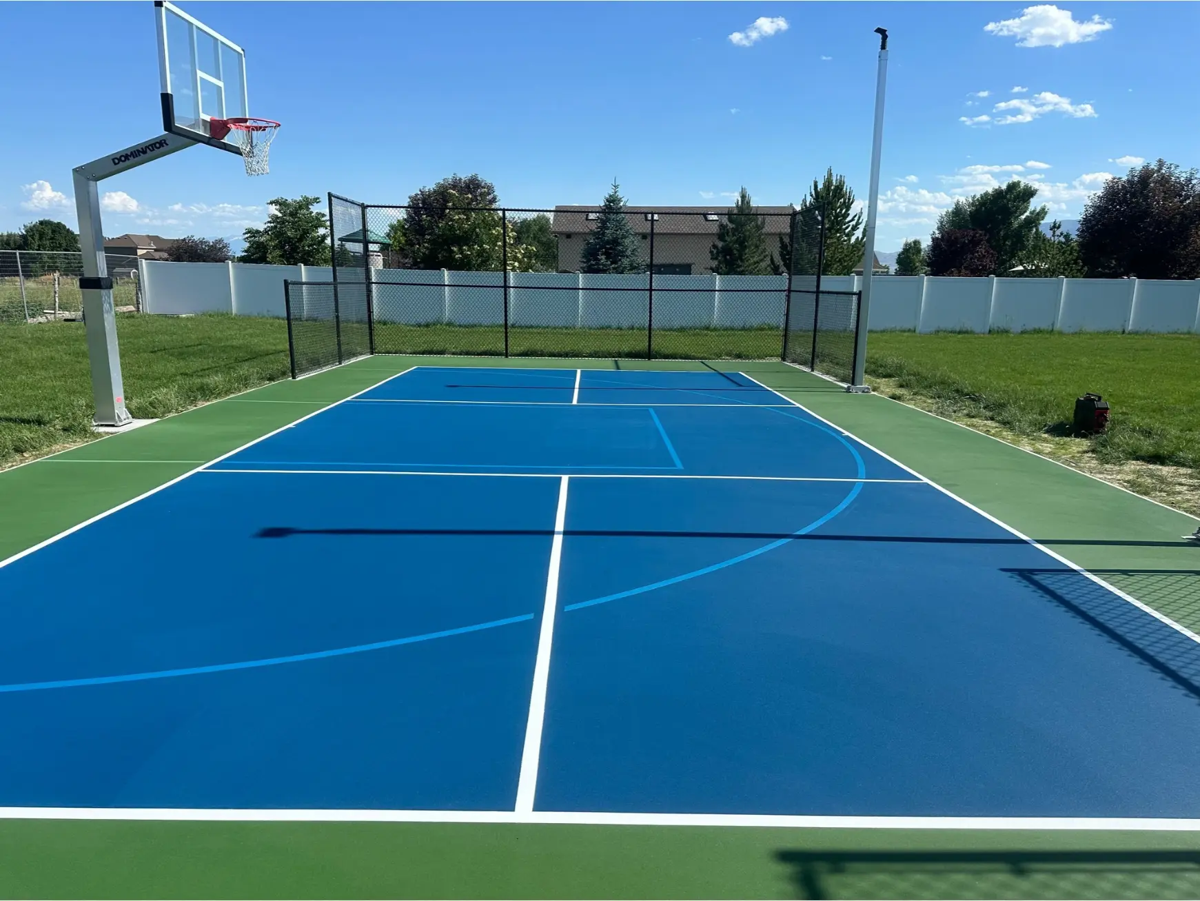 Image of a residential pickleball court upgrade from basketball court