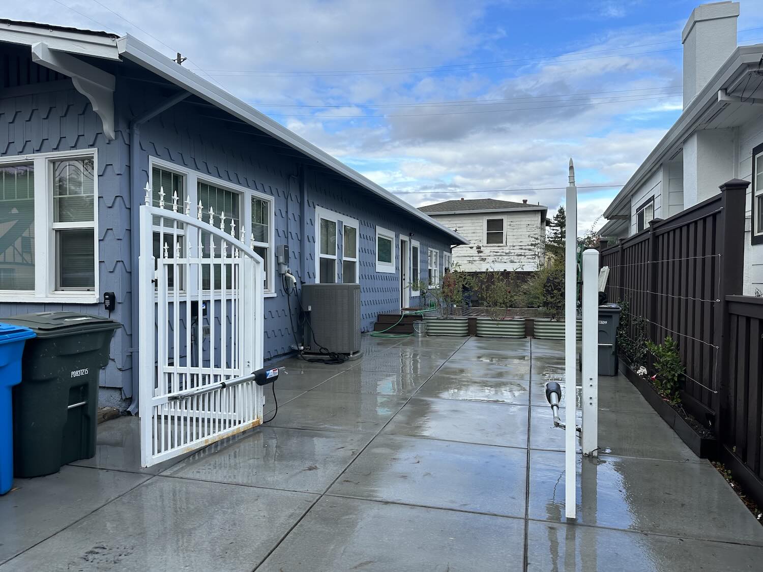 After: completed concrete driveway and gate install in Windsor, CA