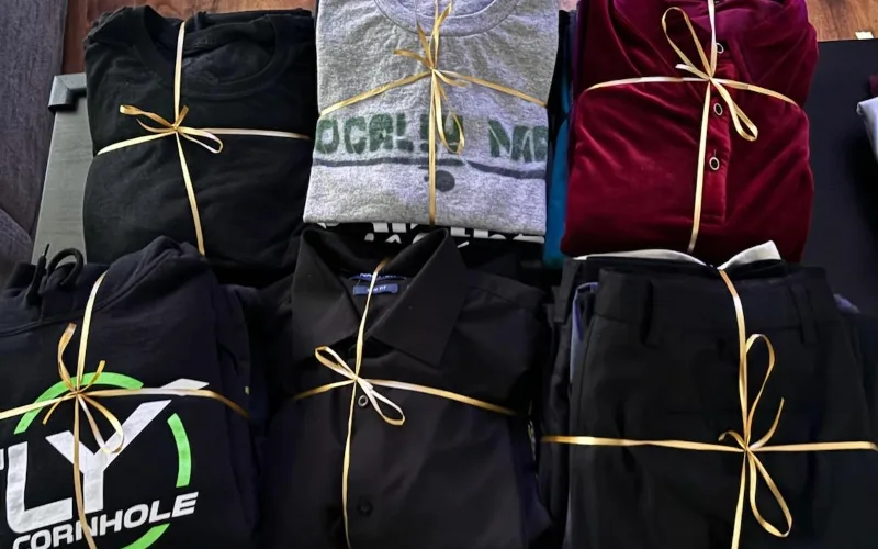 Finished Rustik Solution laundry orders, folded and tied with gold ribbon