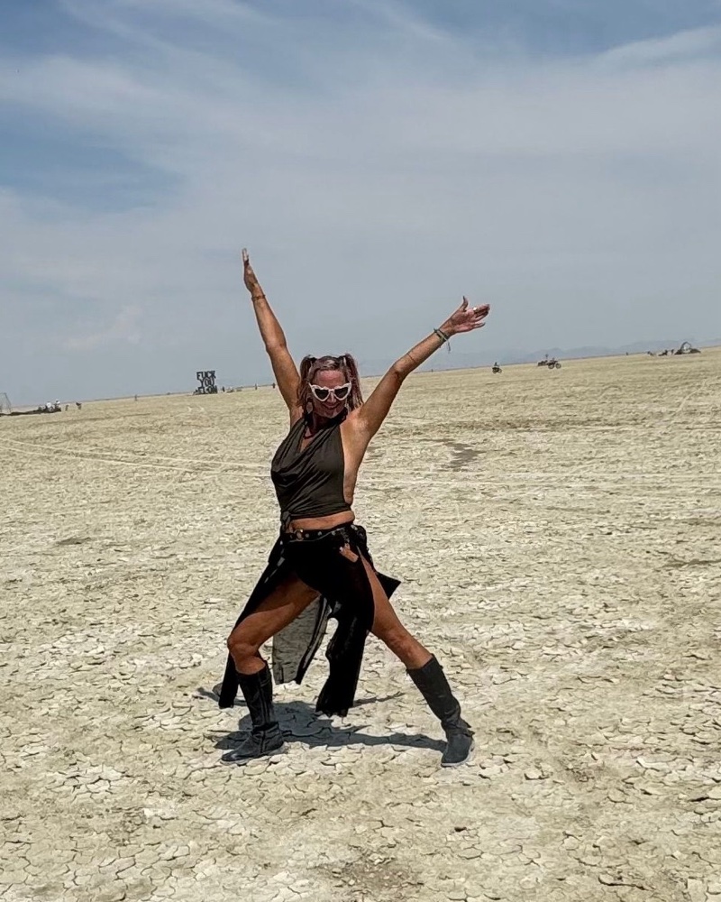 Christie dancing on the playa at Burning Man