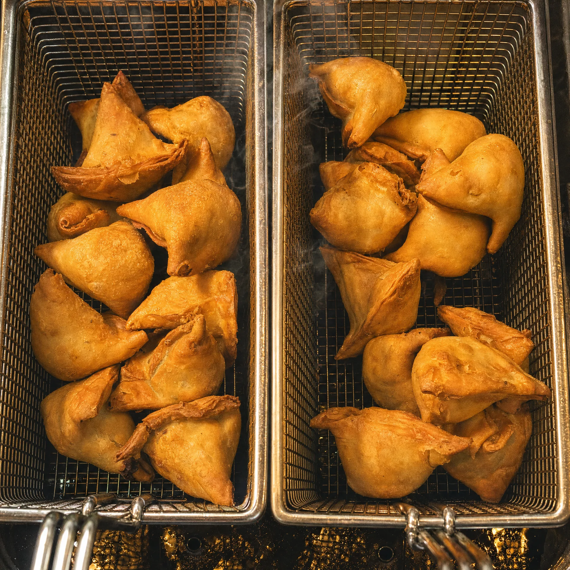 Fresh samosas frying in the 7 Monks Cafe kitchen