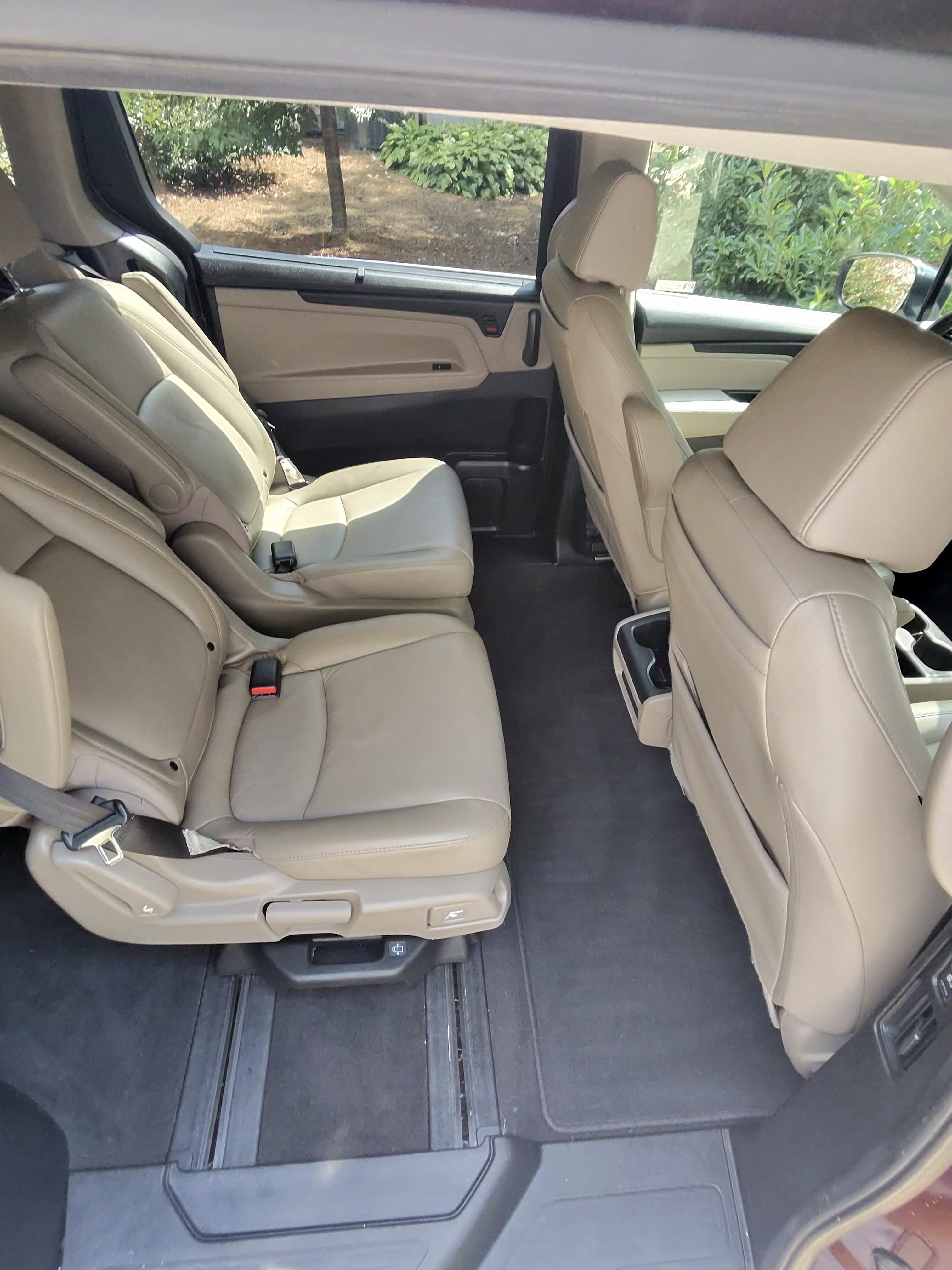 Car interior with two clean tan leather seats