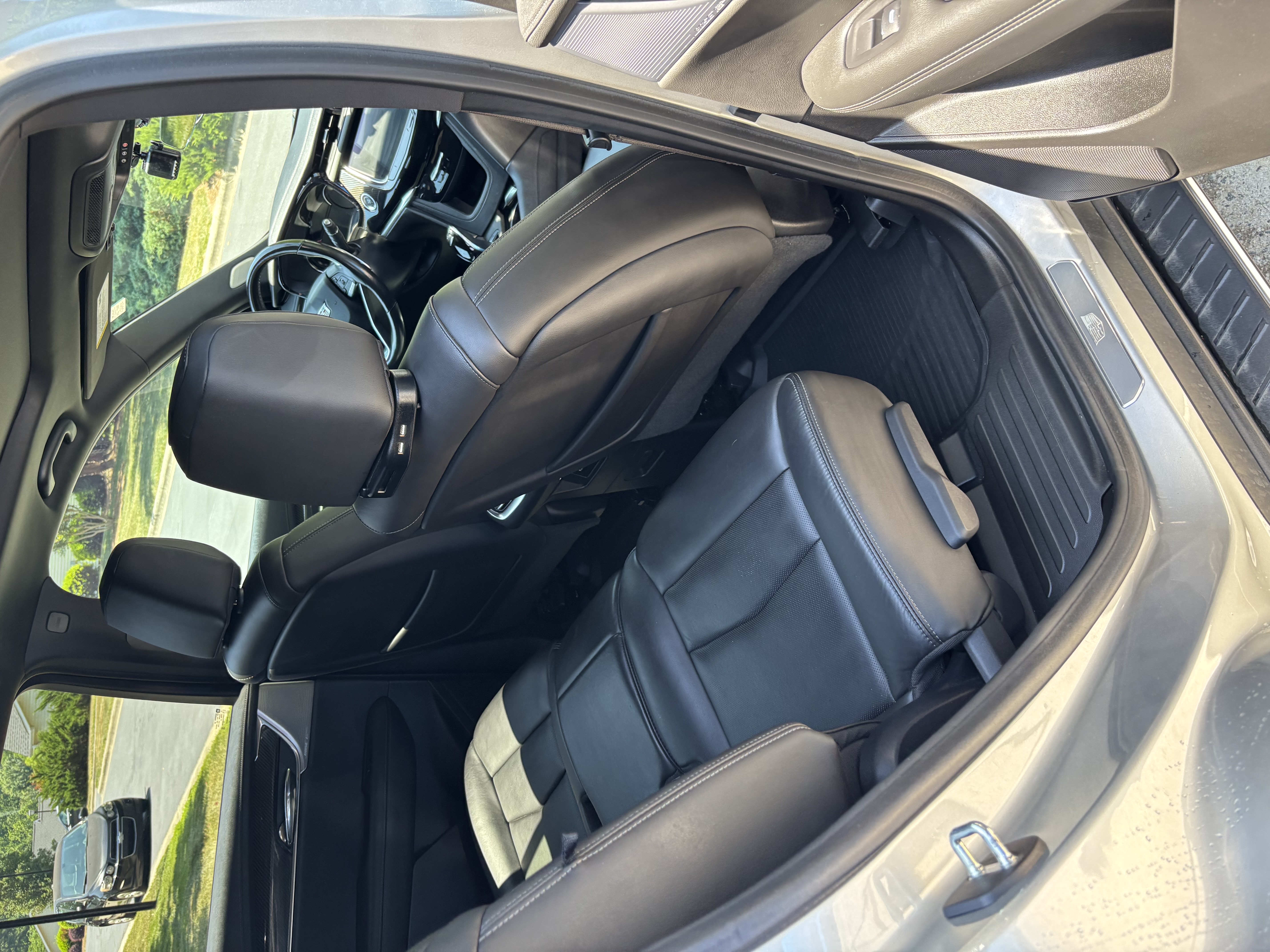 Vehicle interior rear seats upholstered in clean black leather