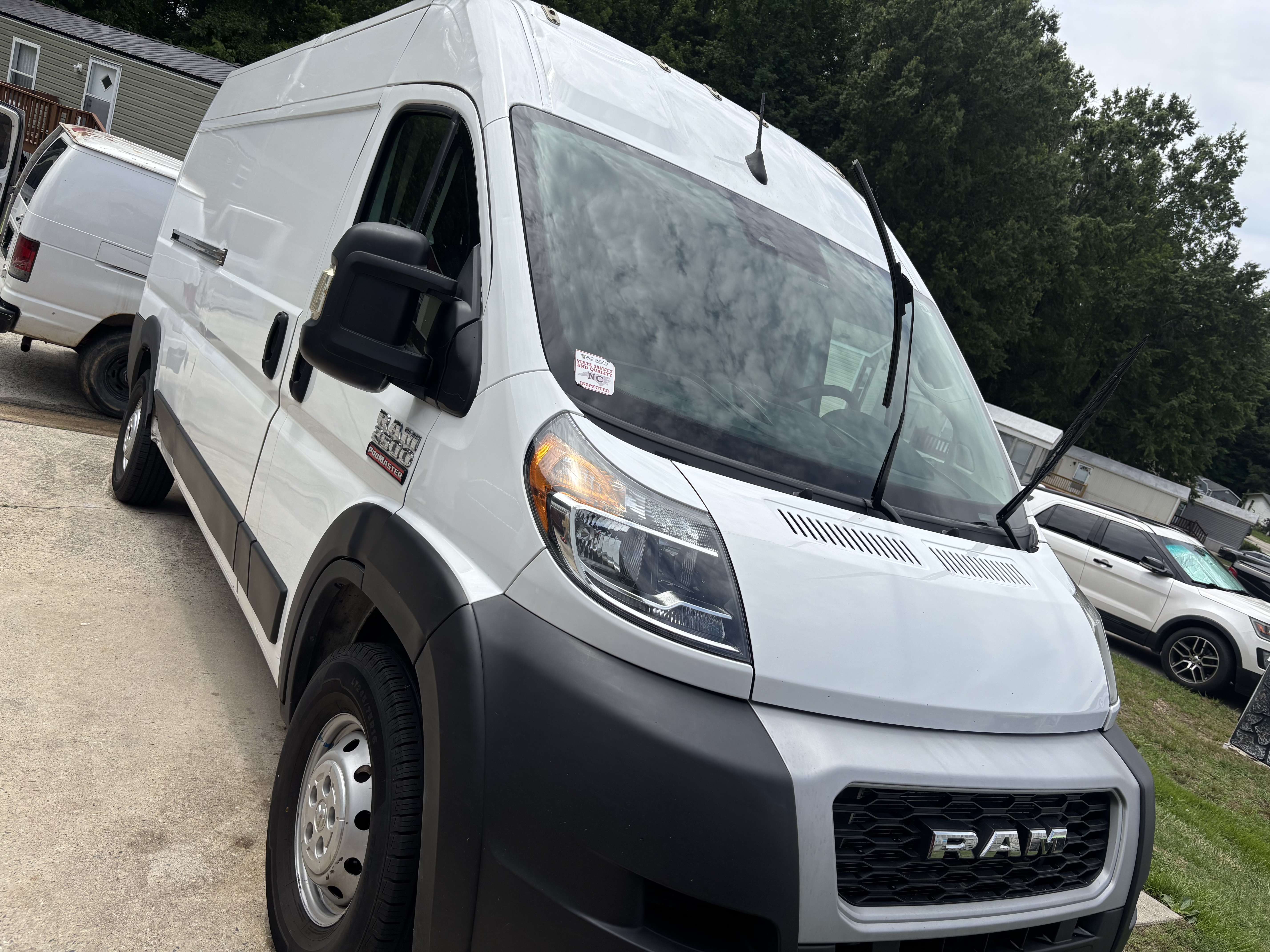 White Ram commercial van detailed and parked in a lot