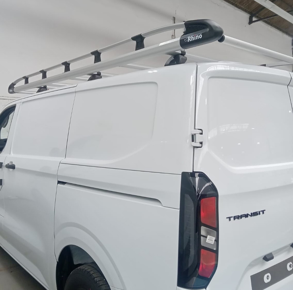 Fitted-out van with Rhino roof system and lined interior