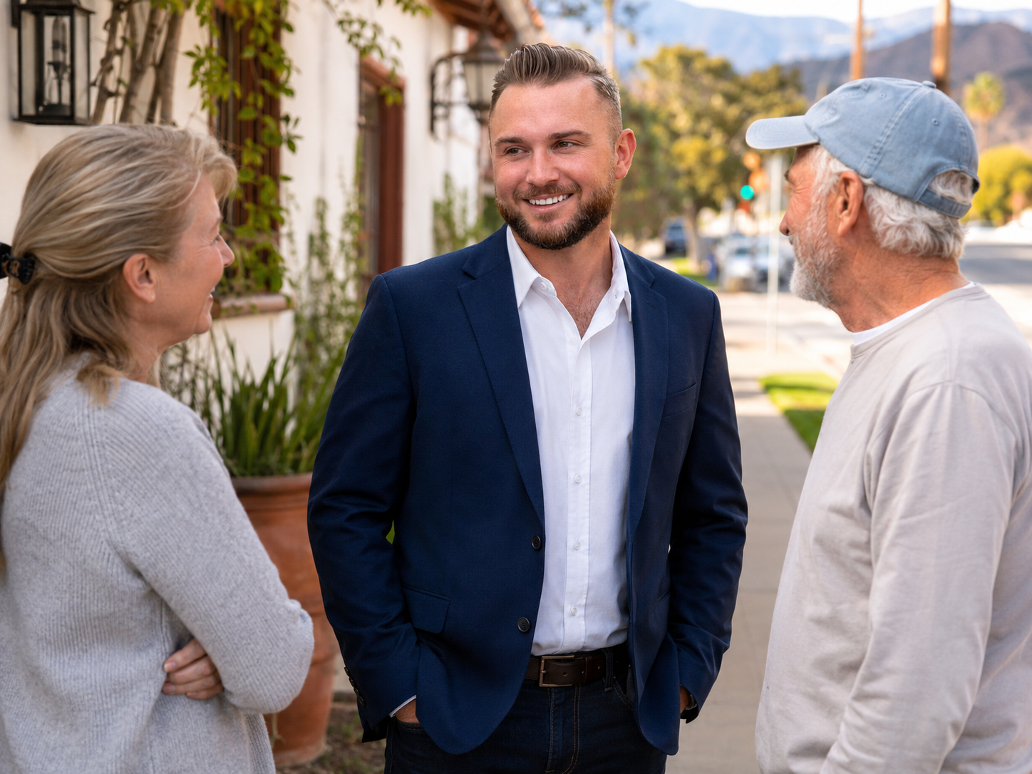 Candidate listening to two residents on a neighborhood sidewalk