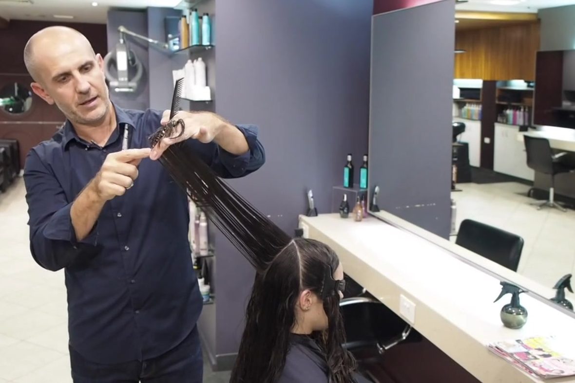 Andrew cutting in his own salon