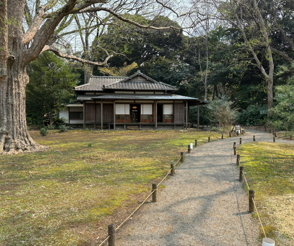A traditional Japanese house beside a garden path