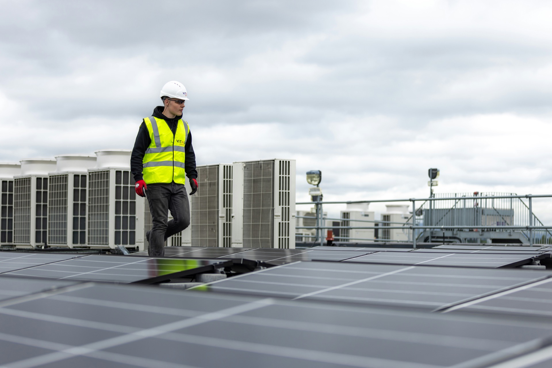 Air Guru technician inspecting rooftop air conditioning units