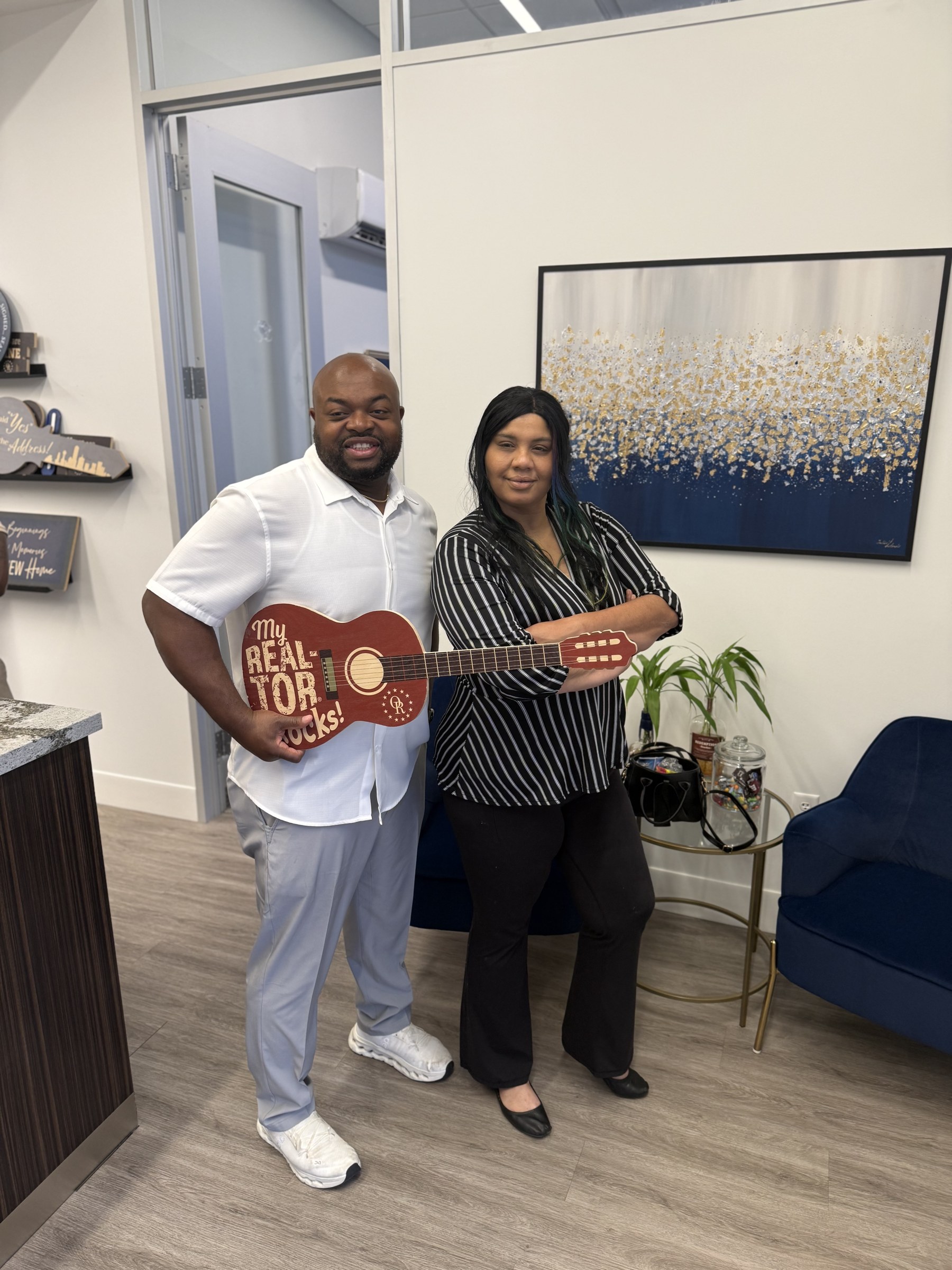 Happy homebuyers on closing day with Brandon Yates in Texas