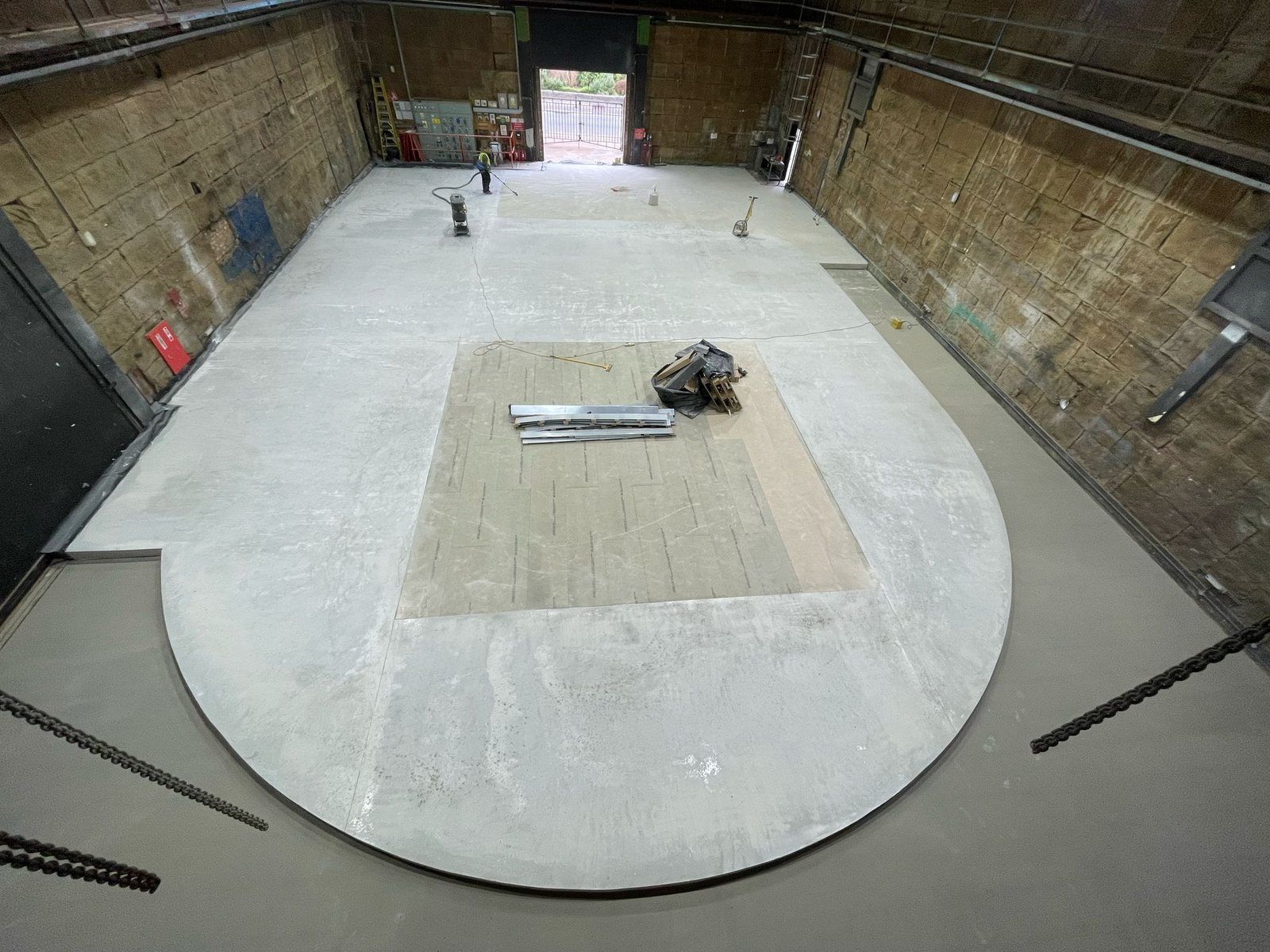 Overview of a circular flowing screed floor inside a sound stage at The Studio Twickenham