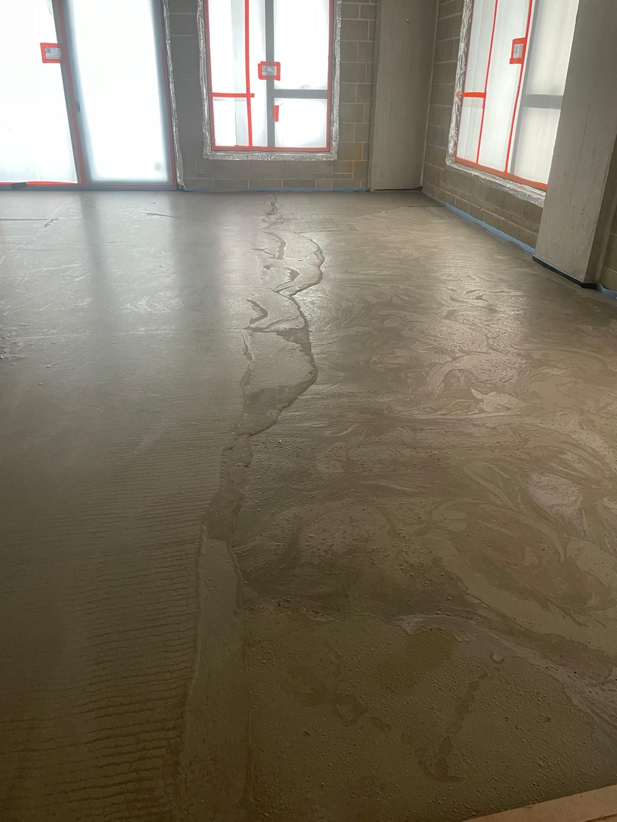 Close view of a smooth flowing screed floor surface at Brentford Lock