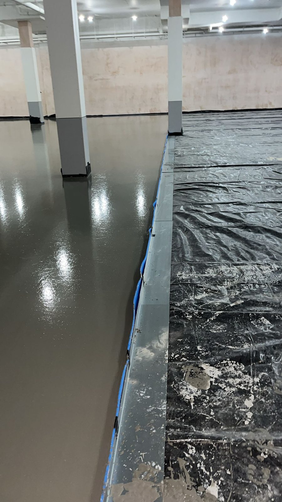 Flowing screed going down inside the Lidl Caterham store