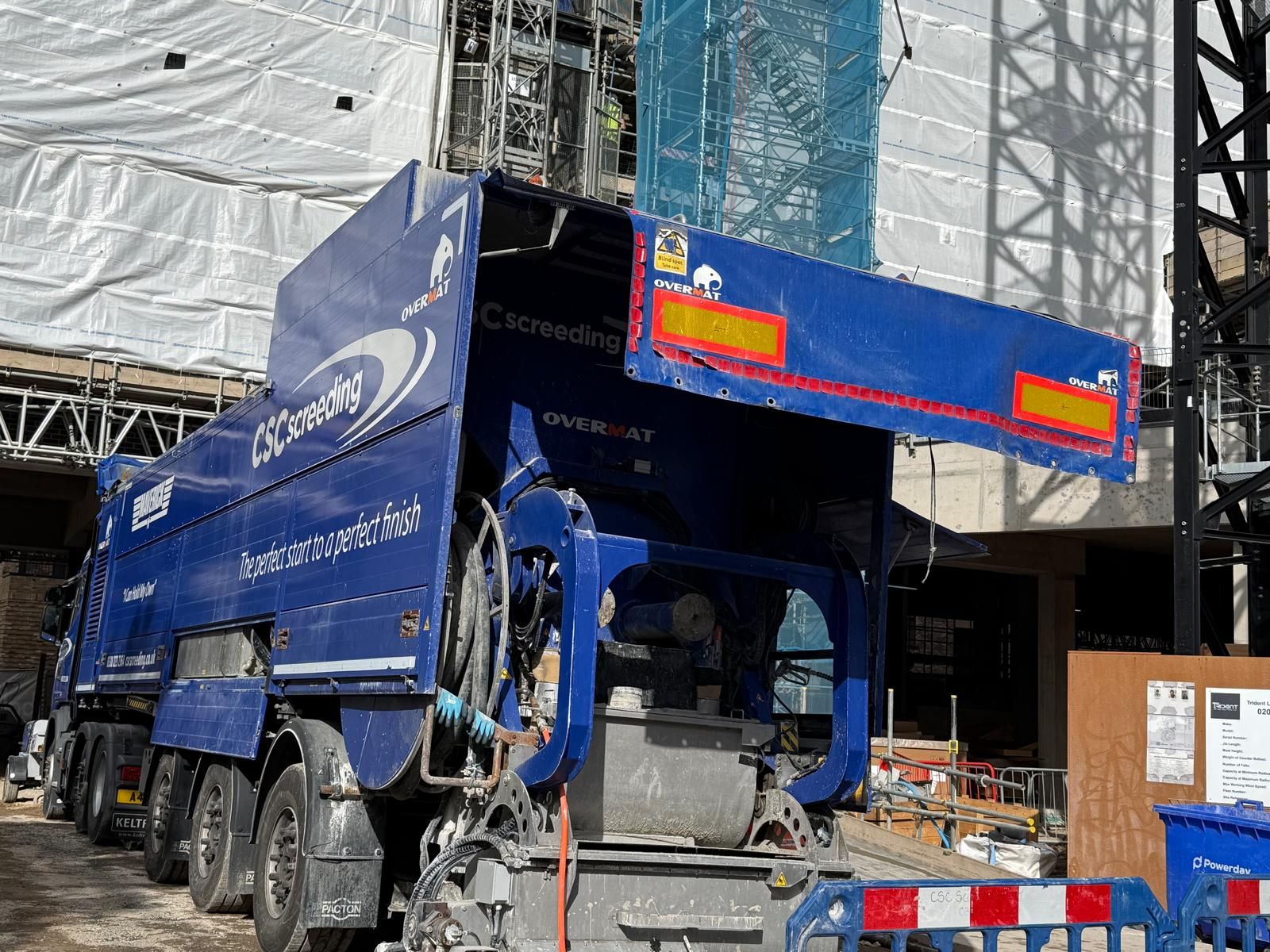 The Maverick tight against the scaffold at Brentford Lock, Blocks J and E