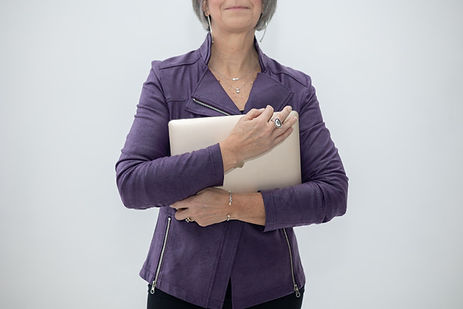 Woman in a purple jacket holding a tablet against a white background Woman in a purple jacket holding a tablet against a white background