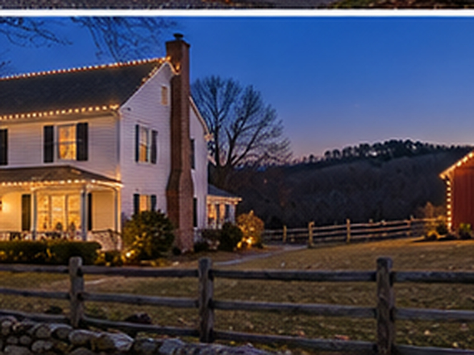 Home in Sherman, CT lit with warm white Christmas lights