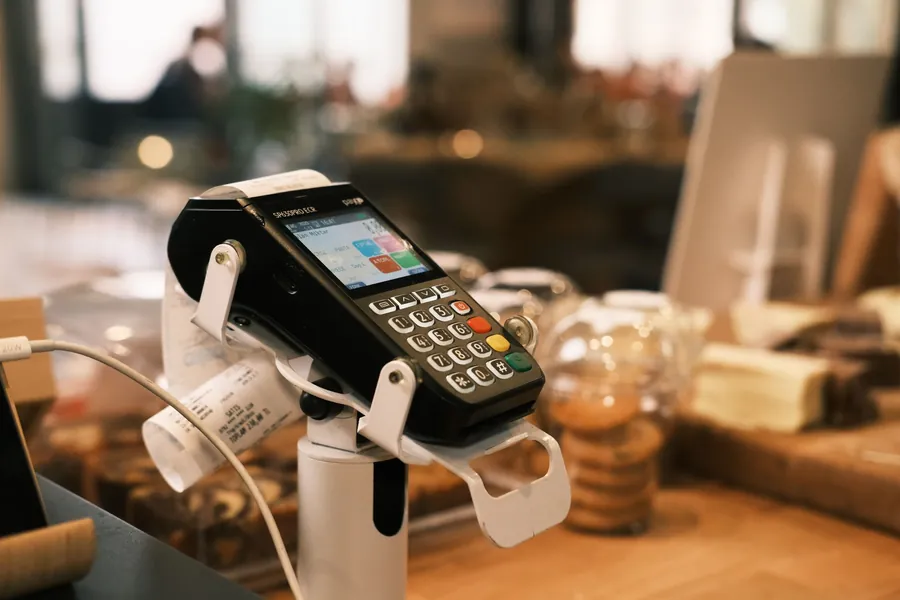 Card payment terminal on a small cafe counter