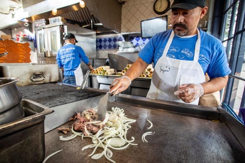 A Grégoire team member cooking at the restaurant grill