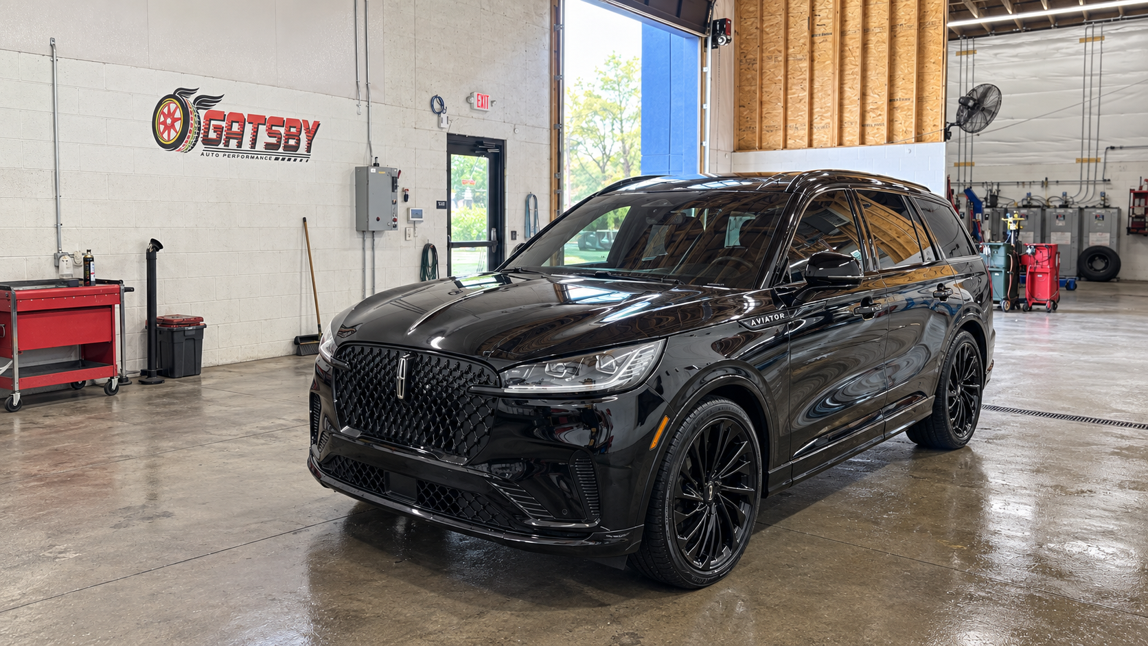 Black Lincoln inside the Gatsby Auto Performance bay