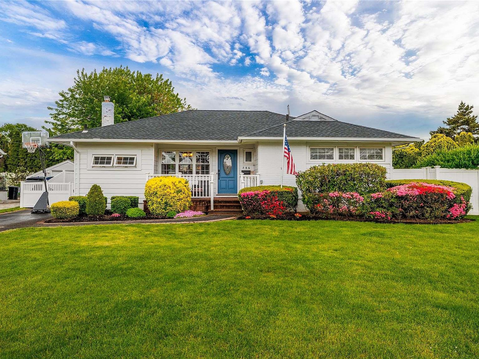 Front of a ranch home in East Meadow that Brandon listed