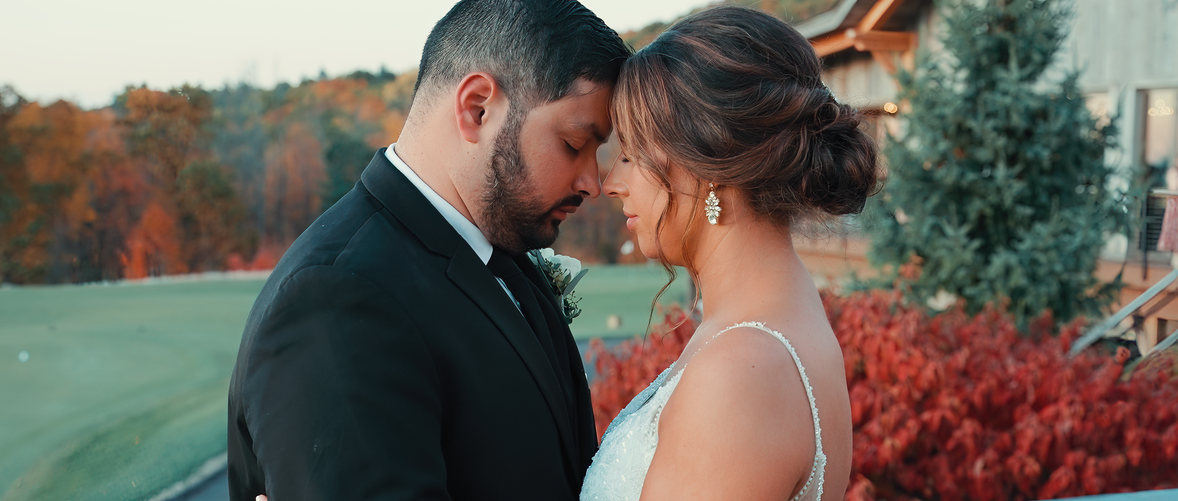 bride and groom touching foreheads wedding videography