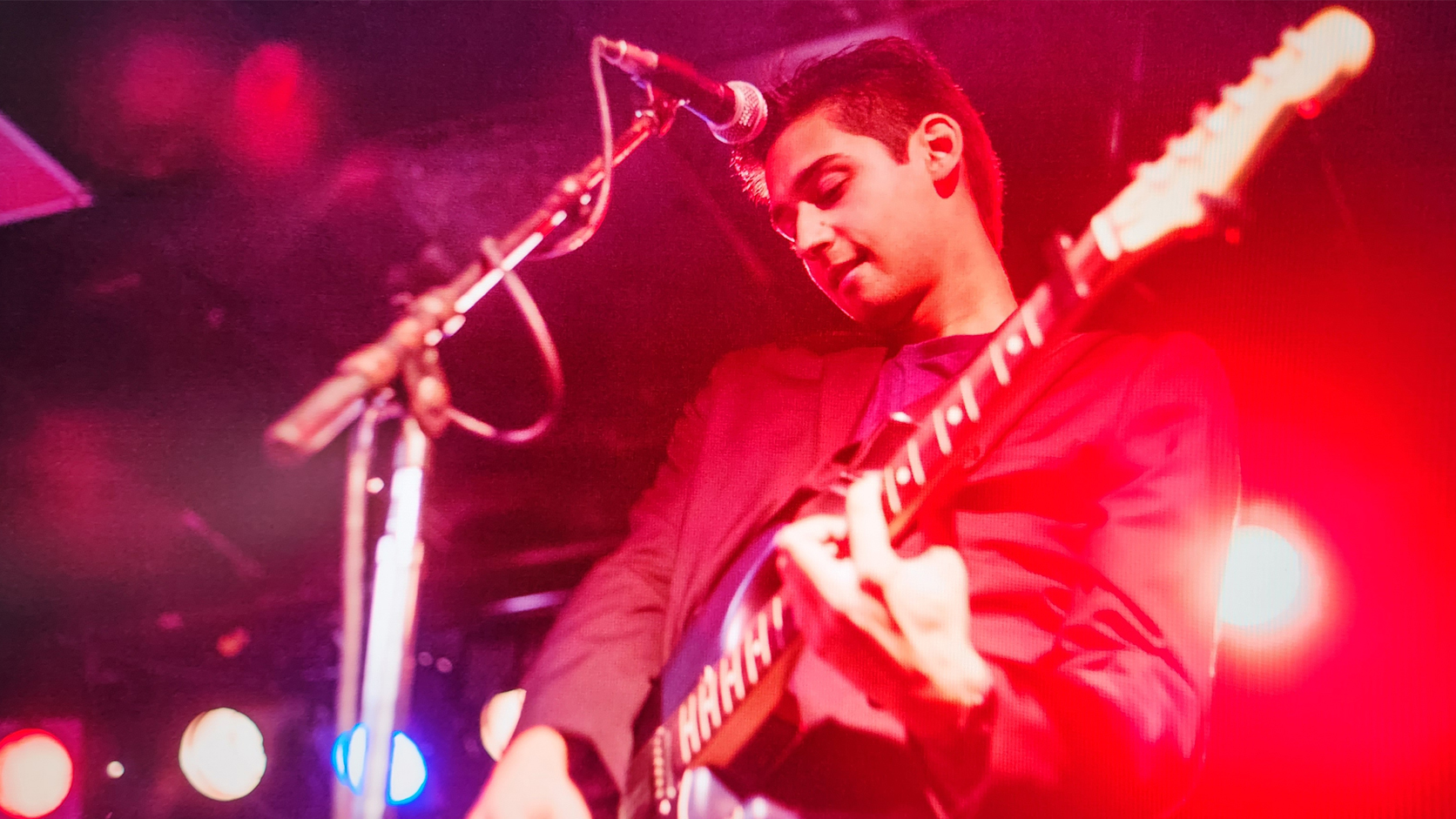 Johnny Pomykacz playing guitar live at Lee's Palace in Toronto