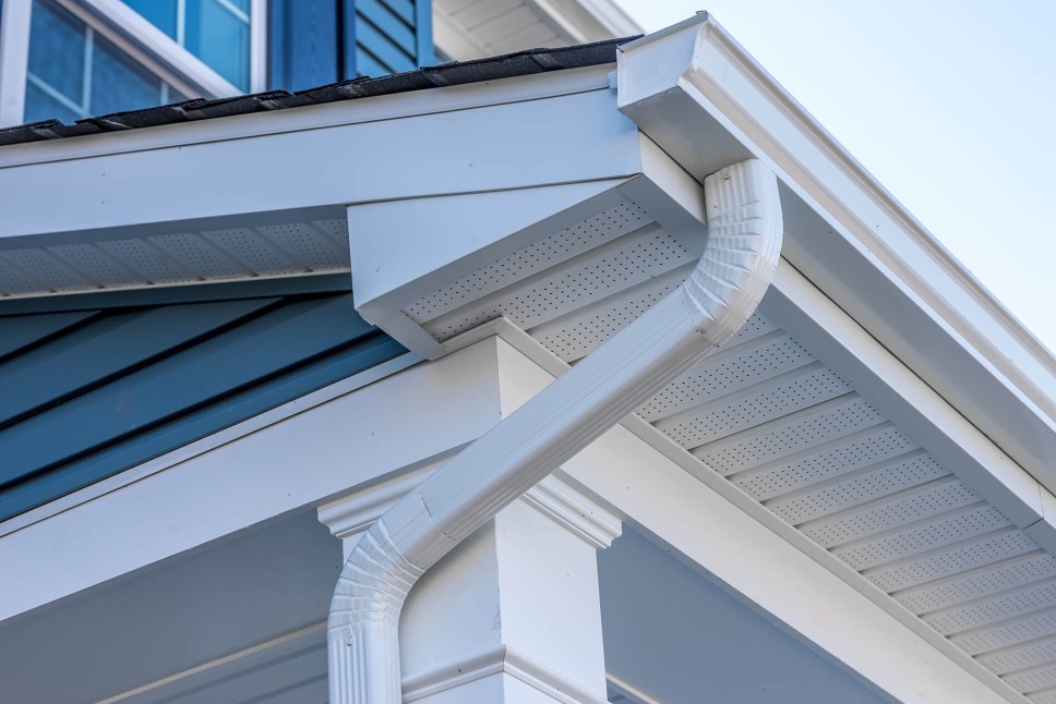 Seamless gutter installation along a roofline
