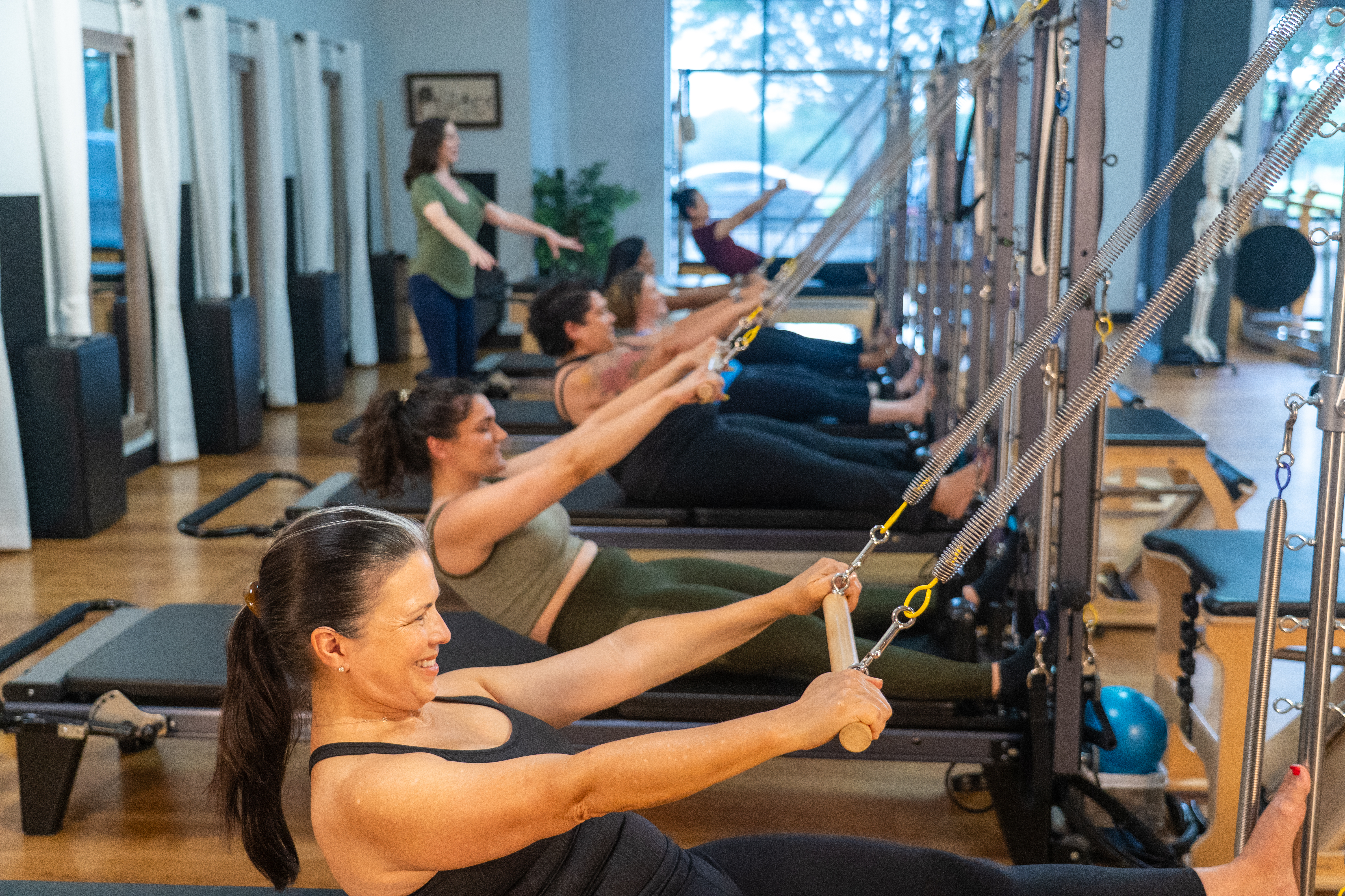 Small group reformer Pilates class at McKinney Movement Center