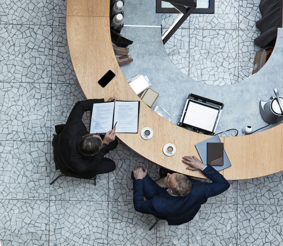 Executive deal environment, dark atmospheric boardroom